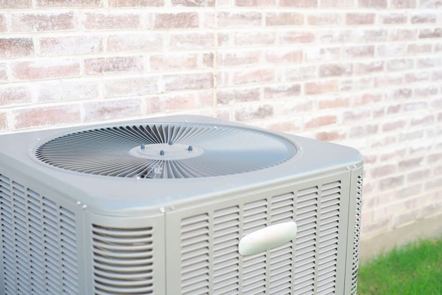 Outdoor AC unit on the side of a home